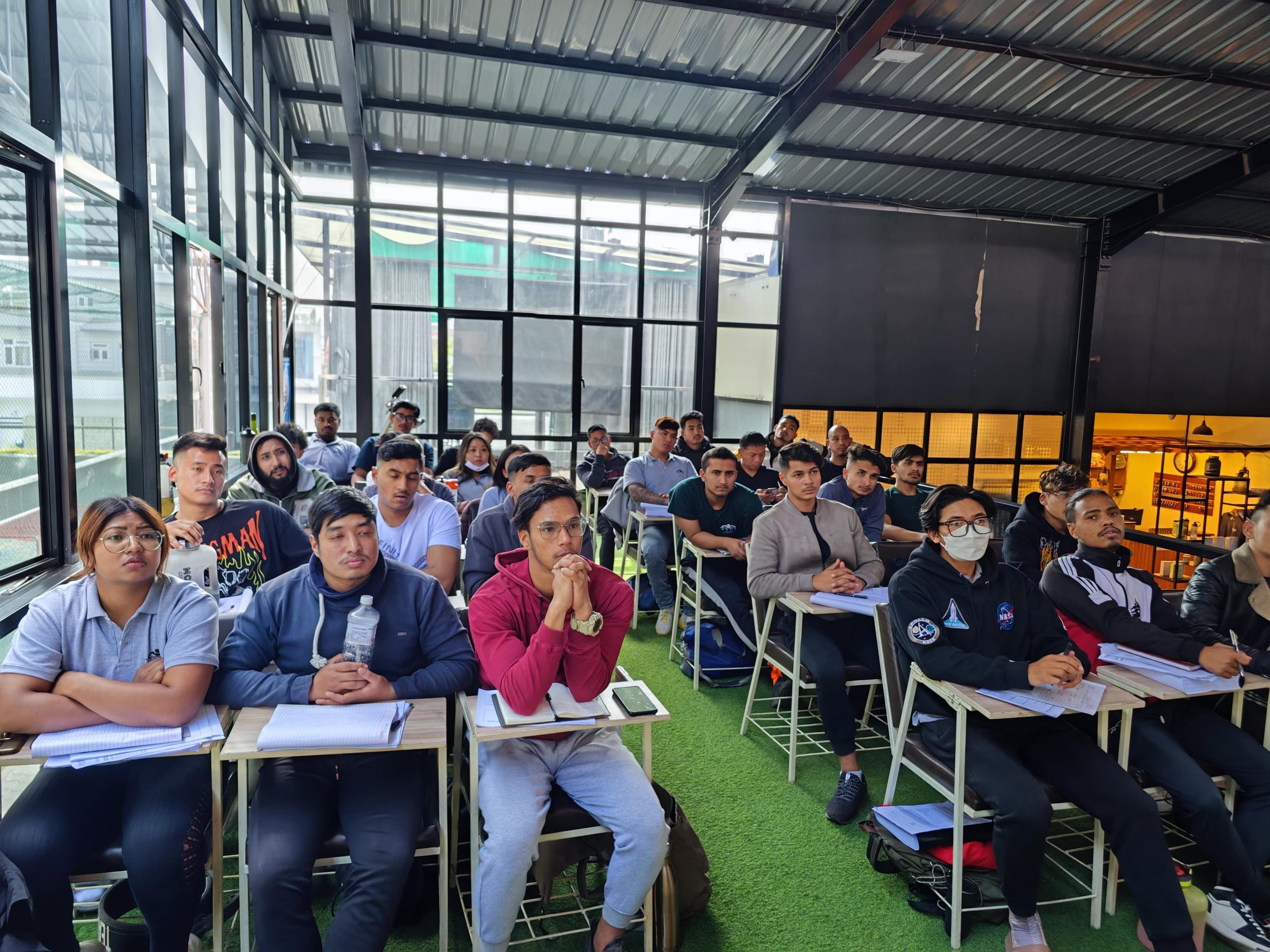 NYFA Nepal CPT classroom session with students engaged in interactive fitness theory and anatomy lessons.